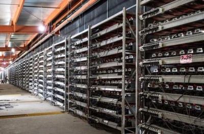 A massive Bitcoin mining farm in a remote Canadian location, harnessing the power of renewable energy.