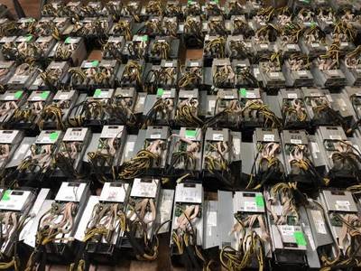 An expansive mining farm in France showcasing rows of efficient rigs