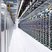 A mining farm filled with rows of mining rigs, showcasing the scale of a typical hosting operation.